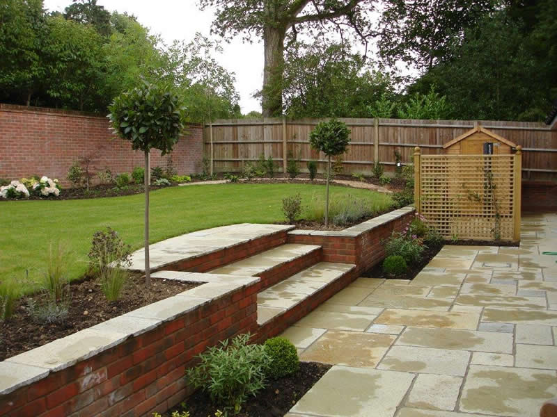 How To Cope With A Sloping Garden Alda Landscapes - How To Build A Level Patio On Slope