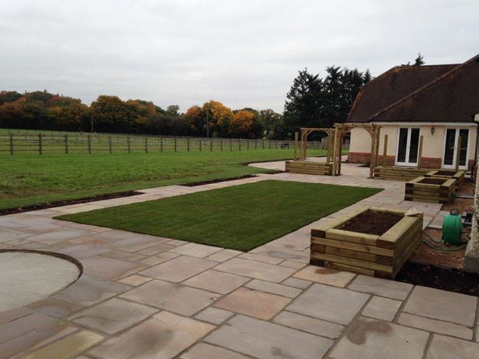 The central lawn is now laid on the final days of the build pulling the finished look together. The placement of a lawn here is an important feature in breaking up the expansive area of paving and providing an injection of colour especially as the planting scheme is yet to take place.