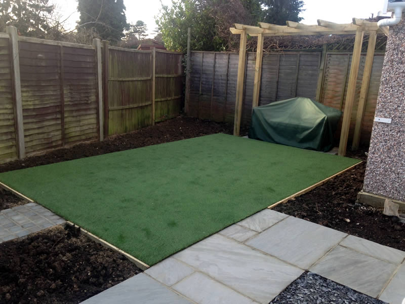 The finished garden works well on many levels and this can be attributed to the attention of detail shown throughout the design.  This is demonstrated in the construction of a wooden arbour over a seating area at one end of the artificial lawn to create a feature.