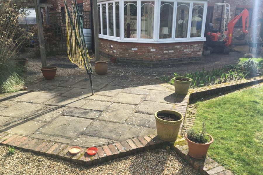 Before photo - shows the old patio area outside the conservatory.