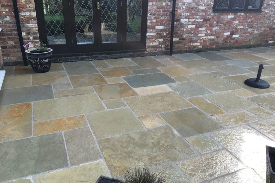 After photo - the new limestone patio has now been laid and transforms the look of the garden.