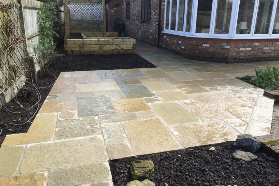 After photo - the new limestone paving makes a real difference to this area of the patio.