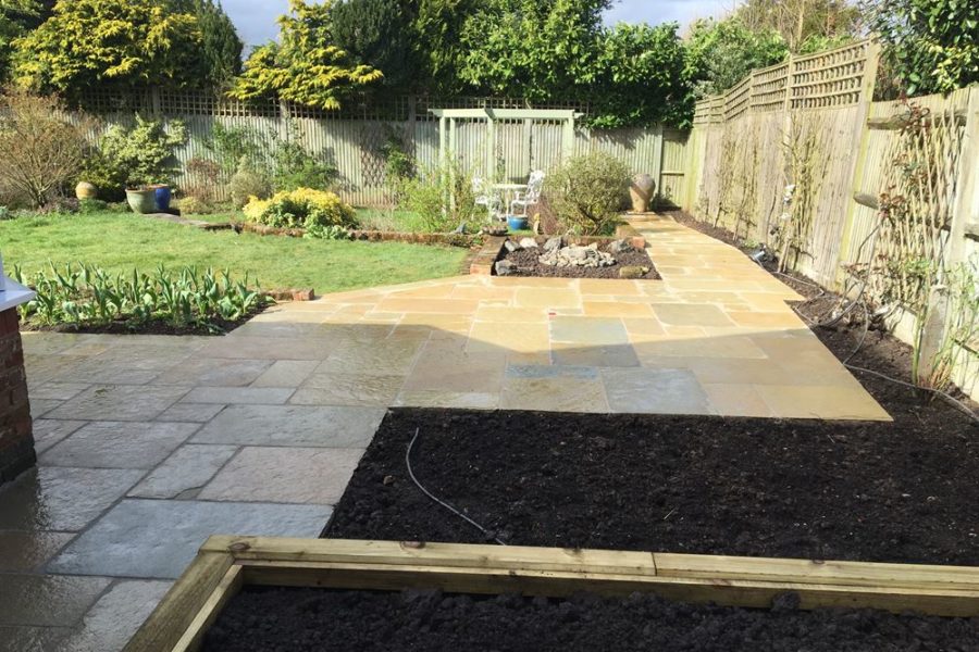 After photo - reveals the new limestone pathway with its more open outlook giving a view to the bottom of the garden.